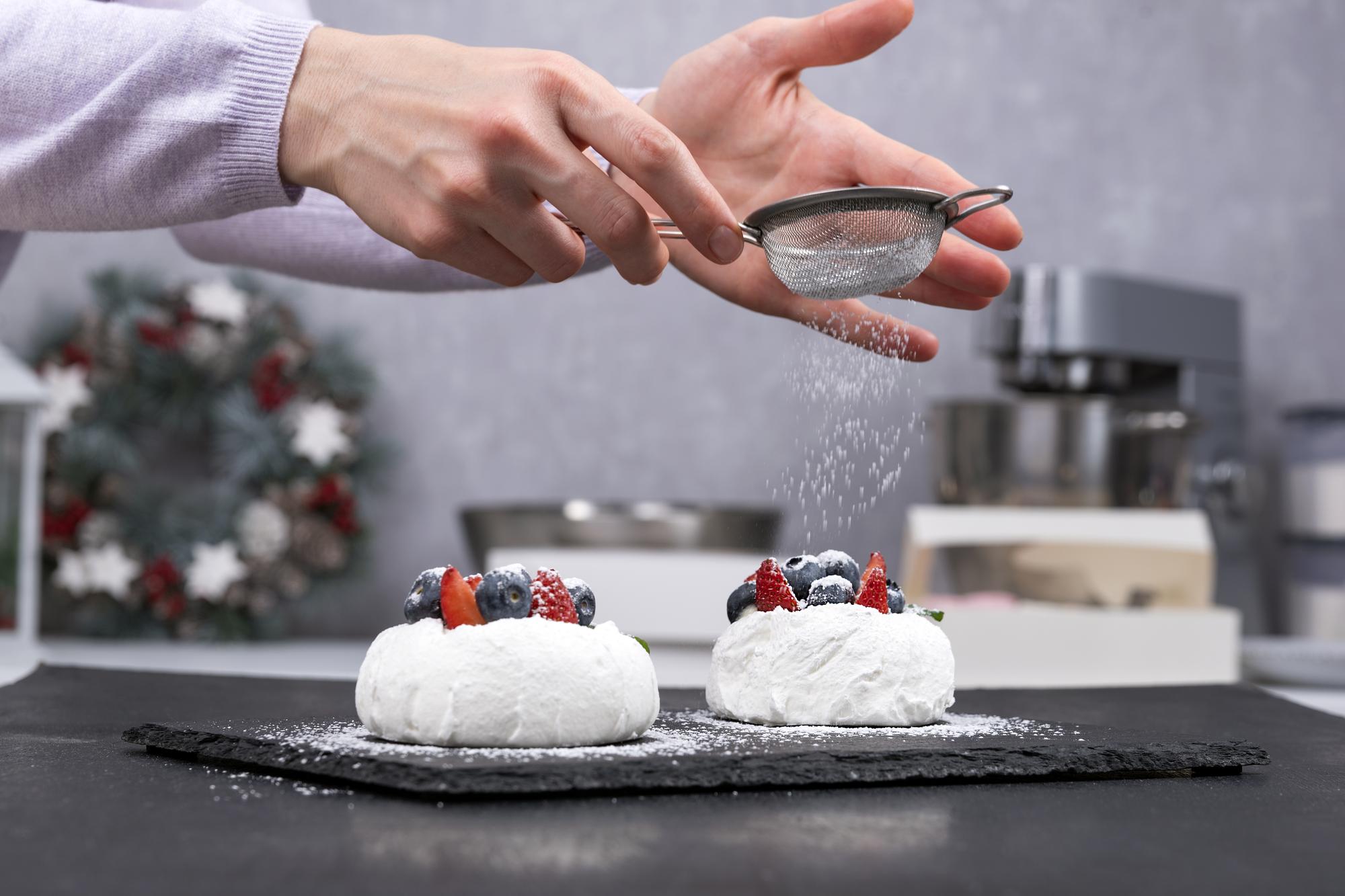 Hands finishing a dessert